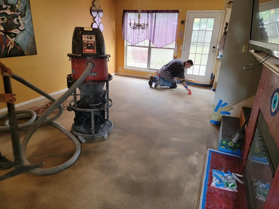 Craftsperson preparing a concrete floor in Austin