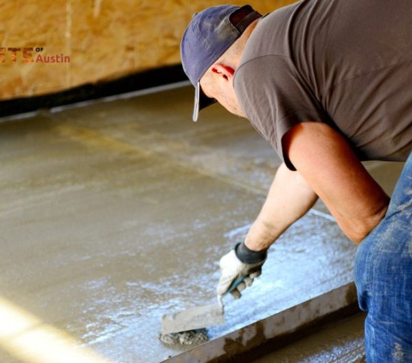 person leveling concrete