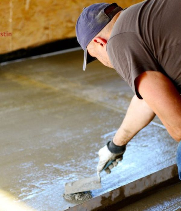 person leveling concrete